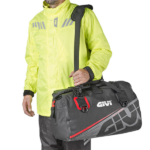 GIVI Tail Bag Waterproof 40L Grey Red worn on the shoulder